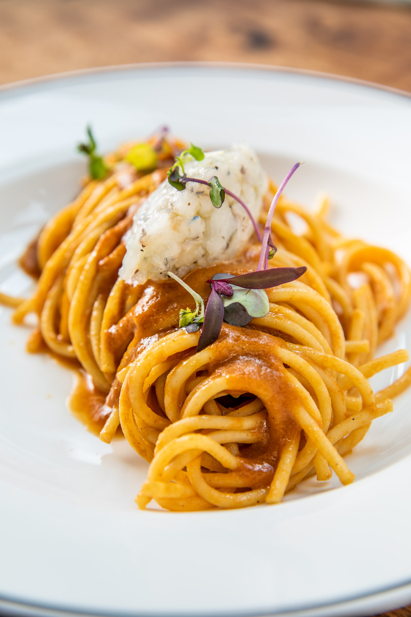 Very Italian spaghetti pasta rolled up for a photography shoot