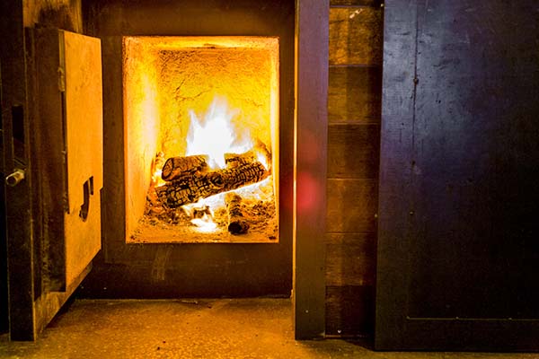 Fire in the smoker at Mighty Quinn's BBQ